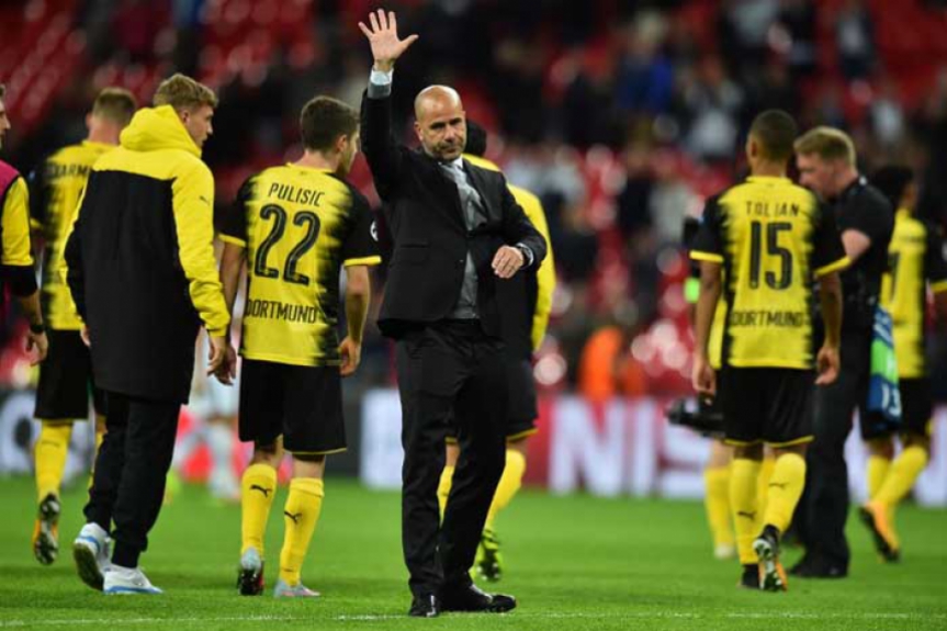 Os jogadores do Borussia Dortmund tentam entender a derrota de 3 a 1 para o Tottenham em Wembley