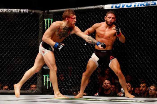 Virada - Após sufoco no round inicial, McGregor se recupera e nocauteia Chad Mendes para se sagrar campeão interino dos penas