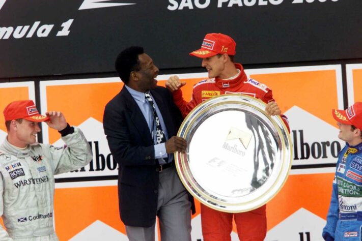 O Rei teve vários encontros com Michael Schumacher. Um deles foi no pódio do GP do Brasil de 2000, vencido pelo alemão.