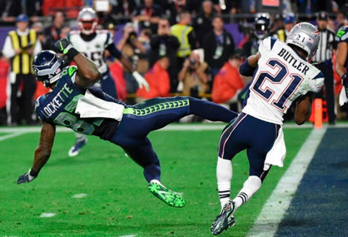 Virada improvável no Super Bowl: Entrando no quarto período do jogo decisivo na NFL, O New England Patriots perdia por 24 a 14 para o Seattle Seahawks. Os Patriots viraram a partida, mas o Seahawks estavam prontos para vencer no estouro do cronômetro. Faltando 15s, o técnico Pete Caroll ordenou uma jogada de passe na linha de 5 jardas do ataque.  Russell Wilson fez o passe e foi interceptado na End Zone por Malcolm Butler, garantiu o Super Bowl para os Patriots.