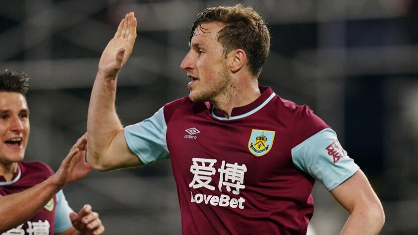 Chris Wood - Clube: Burnley - Seleção: Nova Zelândia - Posição: Atacante - Idade: 29 anos - Valor segundo o Transfermarkt: 8 milhões de euros (aproximadamente R$ 48,36 milhões)