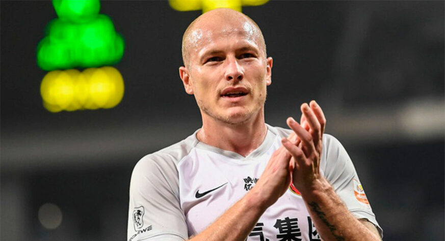 Aaron Mooy (volante) - 31 anos - Contrato com o Shanghai PORT até 31/07/2023 - Valor de mercado: 5 milhões de euros (R$ 27,7 milhões) - Passagem por Manchester City, Brighton e seleção australiana